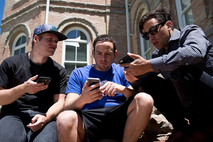 guys-checking-their-phones